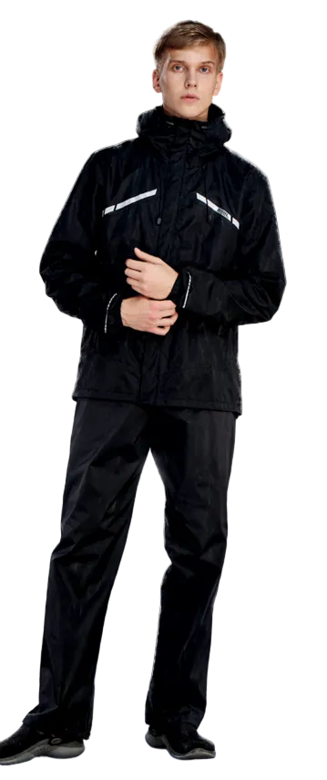 Person wearing a black raincoat and rain pants with Zeel branding on a dark background.